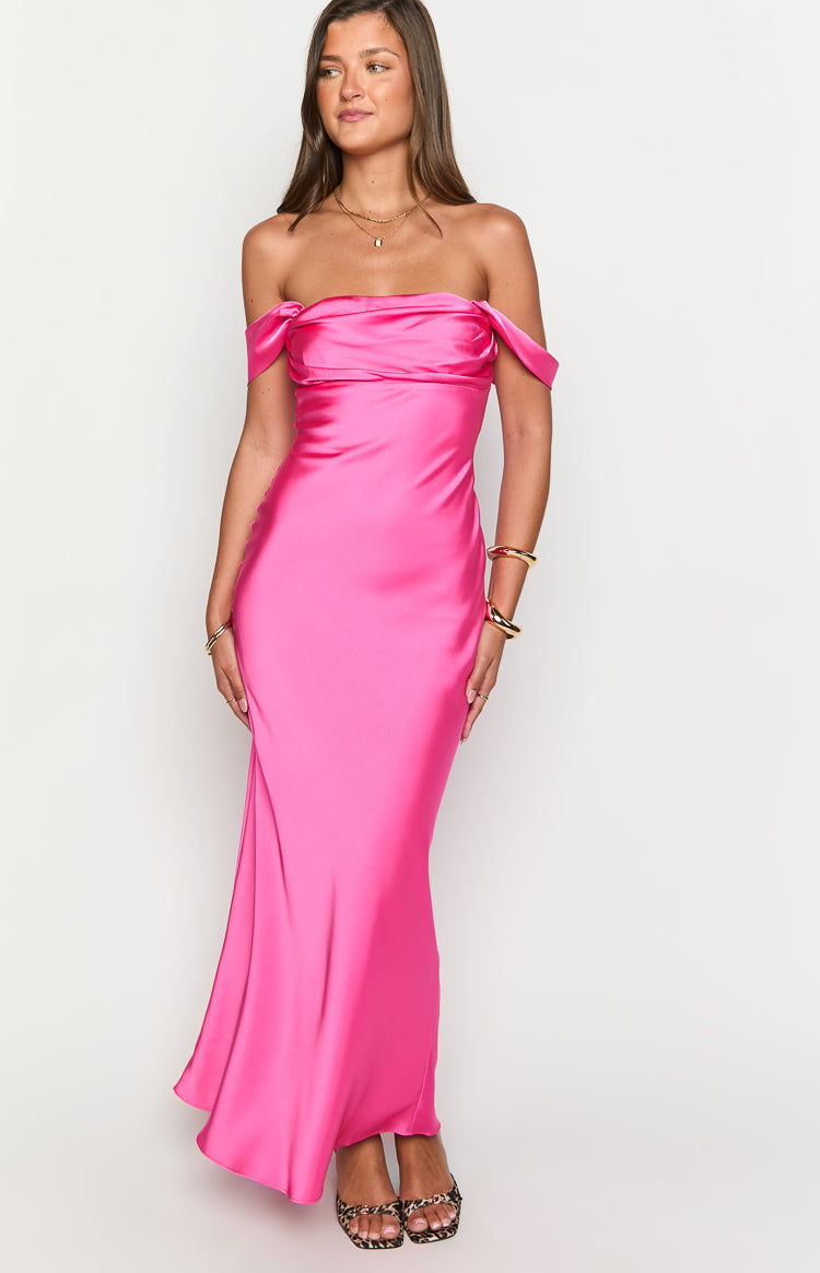 Hot pink off-shoulder formal dress with a draped neckline and flowing satin maxi skirt