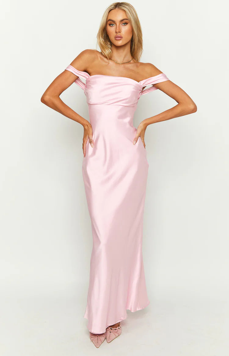 Full-length front view of a light pink satin off-shoulder maxi dress with a draped bodice and flowing skirt