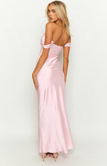 Rear-side view of a light pink satin off-shoulder maxi dress with a low back and flowing skirt