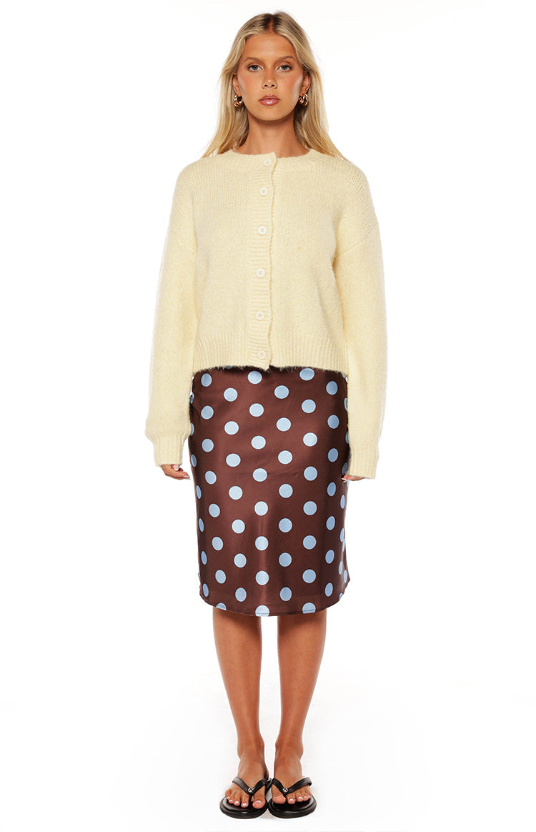 Front view of a butter yellow fuzzy knit cardigan with a round neck, long sleeves, button-down front, and cropped fit
