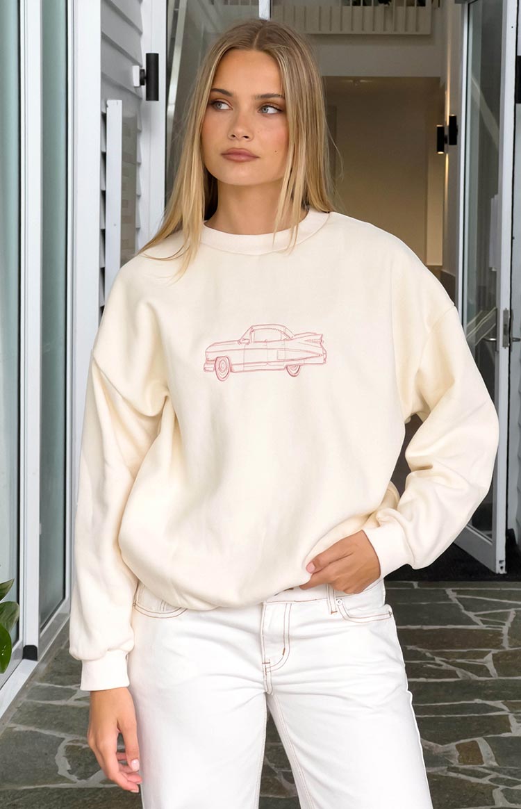 Beginning Boutique Elodie Cream Crew Neck Sweater cream oversized crew neck sweater with pink vintage car graphic
