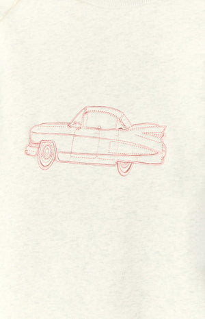Close-up of the pink embroidered vintage car design on the grey crew neck sweater