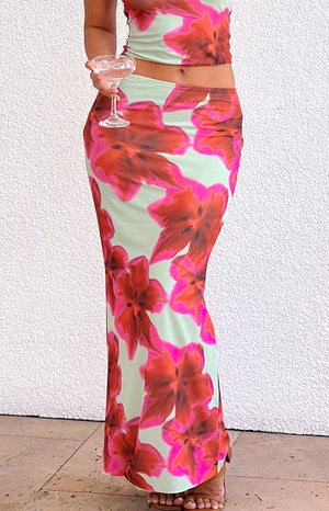 Beginning Boutique Elsa Green Floral Maxi Skirt green floral maxi skirt with large red flowers and a side split