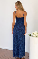 Rear view of a navy blue floral lace maxi dress with thin spaghetti straps and a straight back