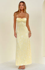 Front view of a yellow floral lace maxi dress with spaghetti straps and a ruched bust