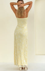 Rear view of a yellow floral lace maxi dress with thin adjustable spaghetti straps