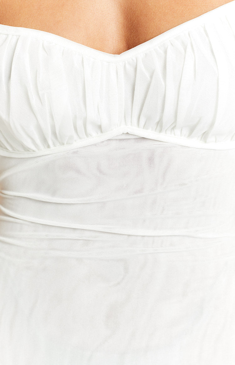 Close-up of the white sheer mesh fabric with ruched sweetheart neckline and fitted bodice