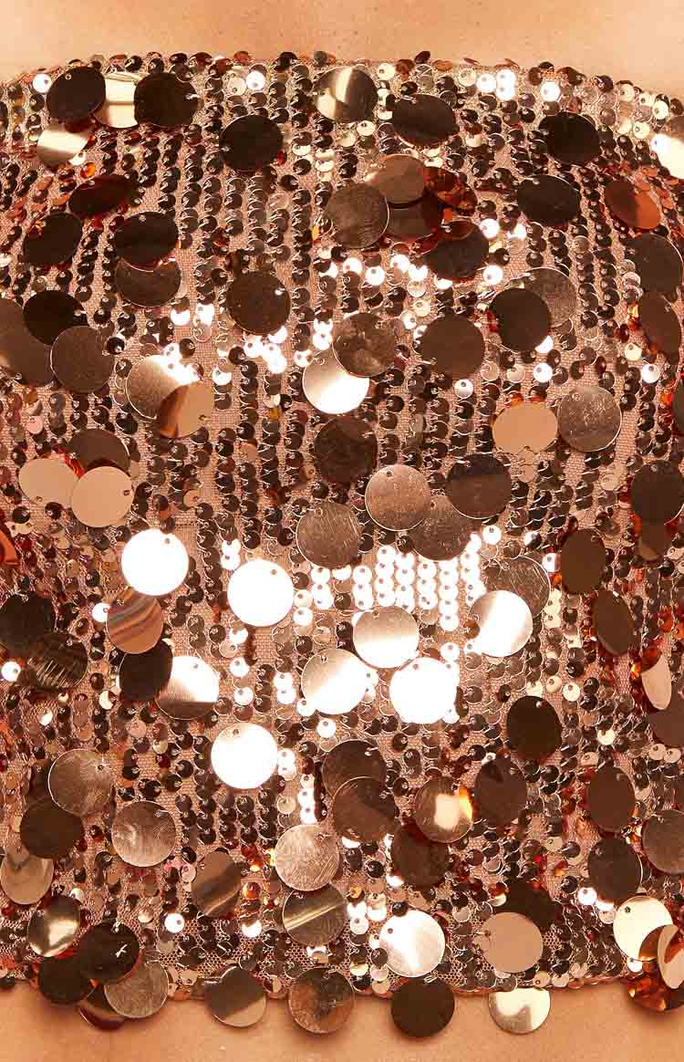 Close-up of the bronze sequin strapless crop top with large shimmering round sequins