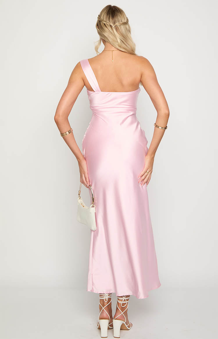 Back view of a light pink satin maxi dress featuring a single wide shoulder strap and a smooth, flowing silhouette