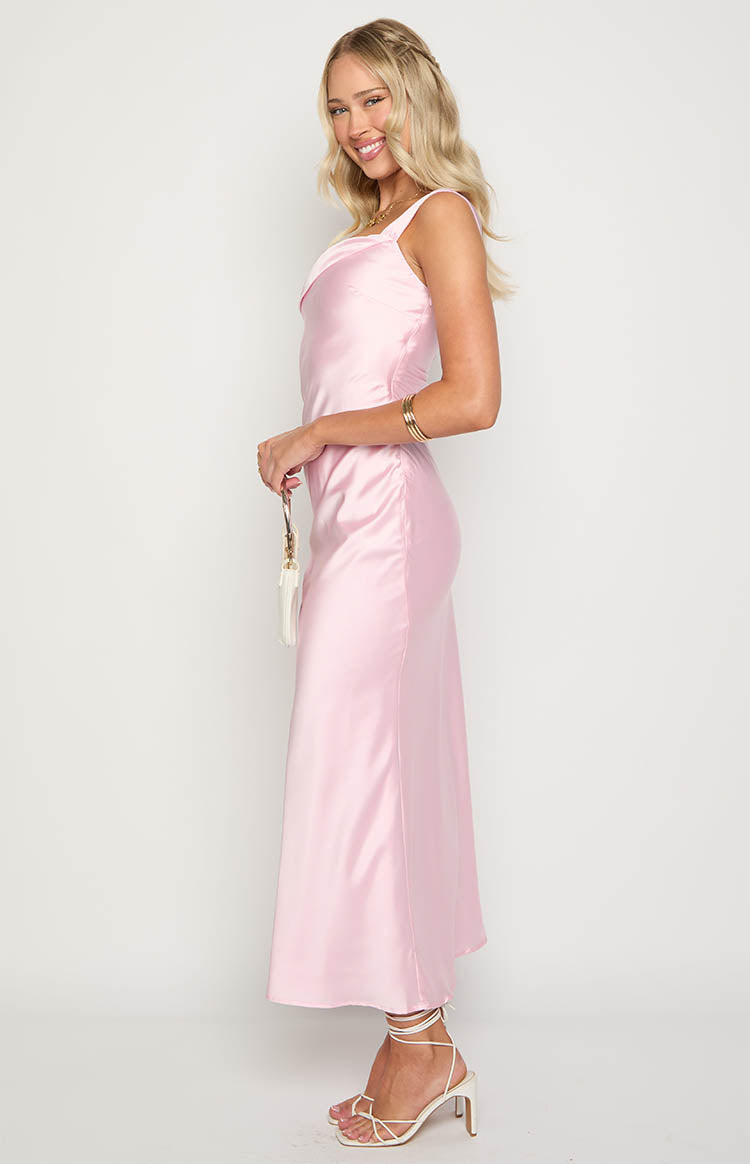 Side view of a pink satin maxi dress with a cowl neckline and ruched detailing on the side