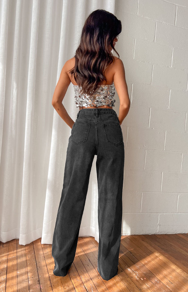 Rear view of black straight leg jeans with back pockets and a high waist