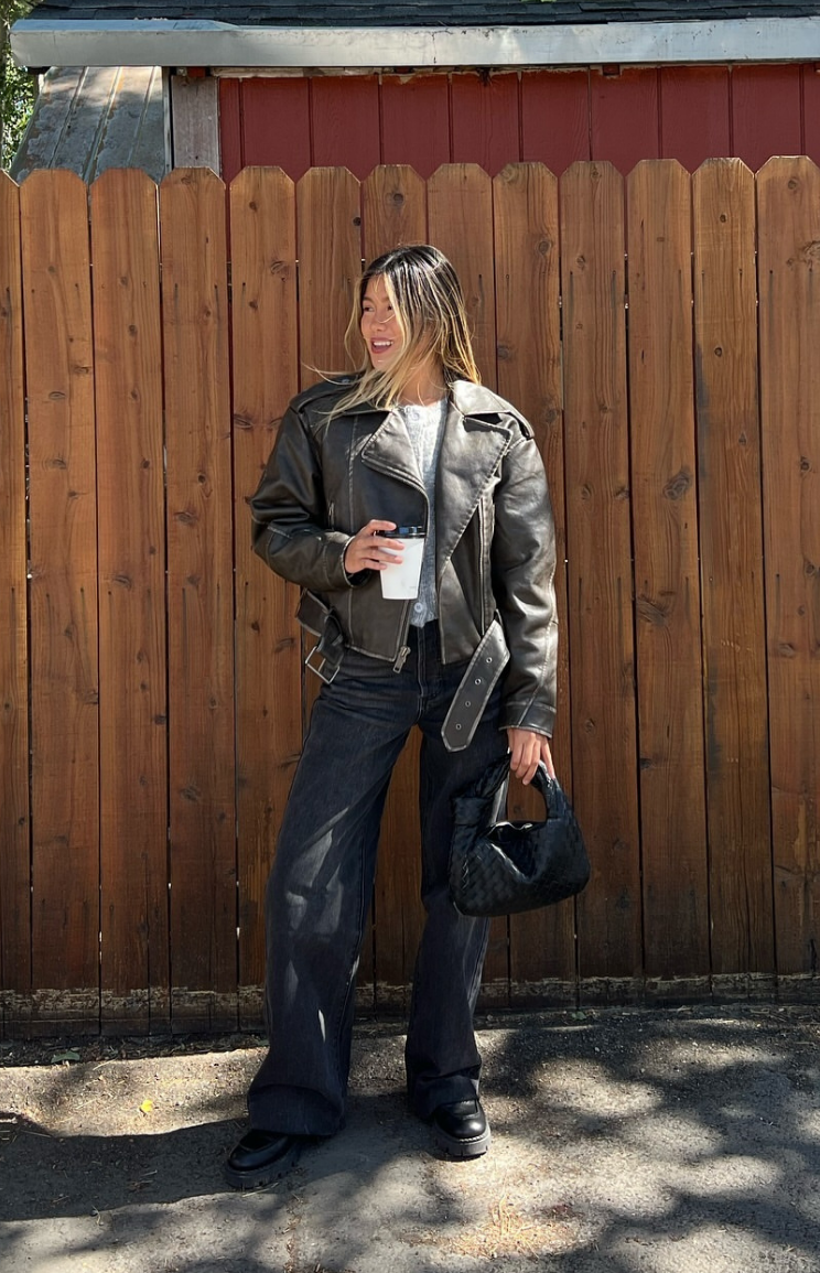 Full length black straight leg jeans with a relaxed fit and subtle wash fading