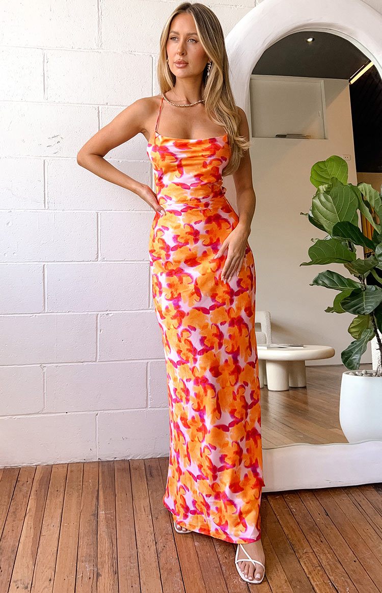 Front view of the azalea pink, orange, and fuchsia floral print midi dress showing its fitted bodice and flowing skirt