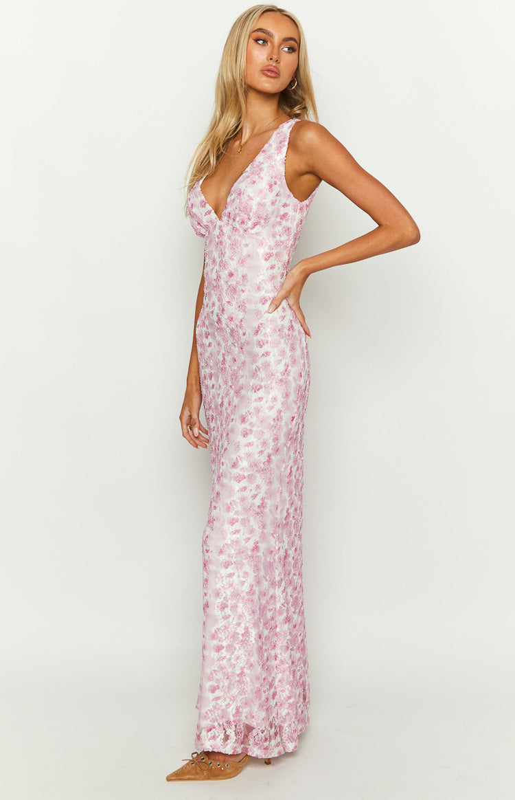 Side view of a fitted pink floral lace maxi dress, showing the full length of the intricate pattern