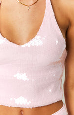 Close-up of the light pink sequin halter top, highlighting the V-neckline and iridescent round sequin texture