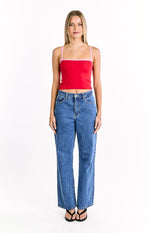 Front view of a red cropped knit top with thin pink spaghetti straps and a pink square neckline trim