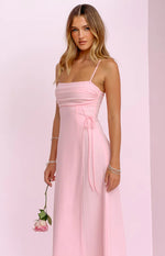Close-up of the ruched bodice and adjustable tie-up detail on the side of the pink sleeveless dress