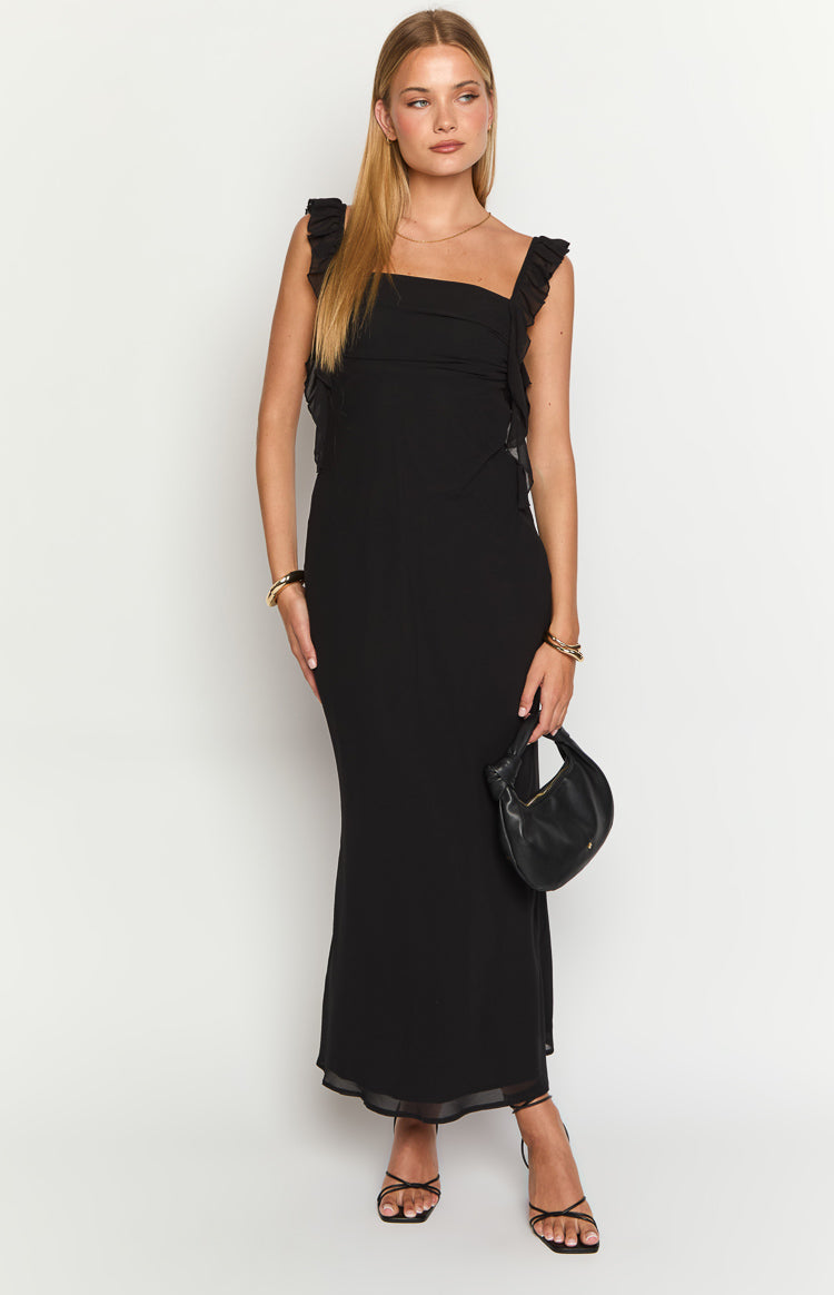 Front view of a black maxi dress with square neckline, ruffled shoulder straps, ruched bodice, and sheer hem