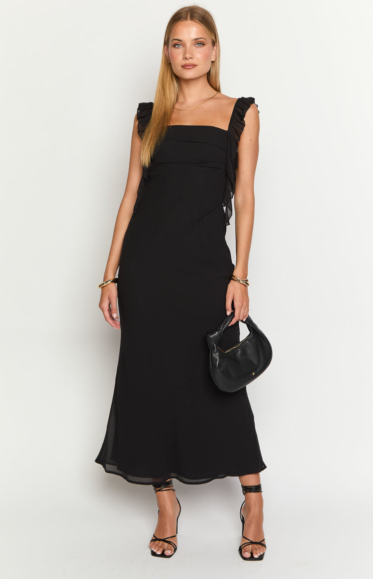 Black maxi dress with square neckline, ruffled shoulder straps, and diagonal ruffled bodice detail