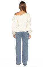Rear view of mid wash blue denim jeans with a relaxed straight leg fit and visible back pockets