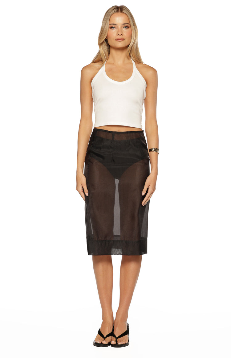 Black sheer organza midi skirt with a straight fit, paired with a white ribbed halter crop top