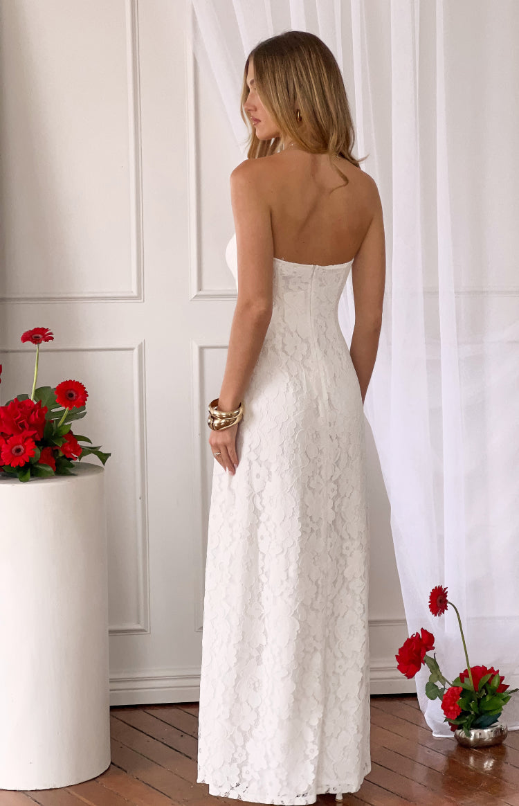 Rear view of a white lace strapless maxi dress showing the back zipper and full lace pattern