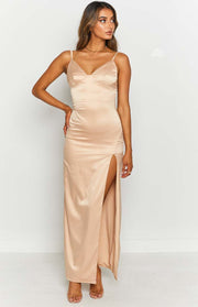 Champagne satin maxi dress with thin spaghetti straps, a sweetheart V-neck, and a high side split