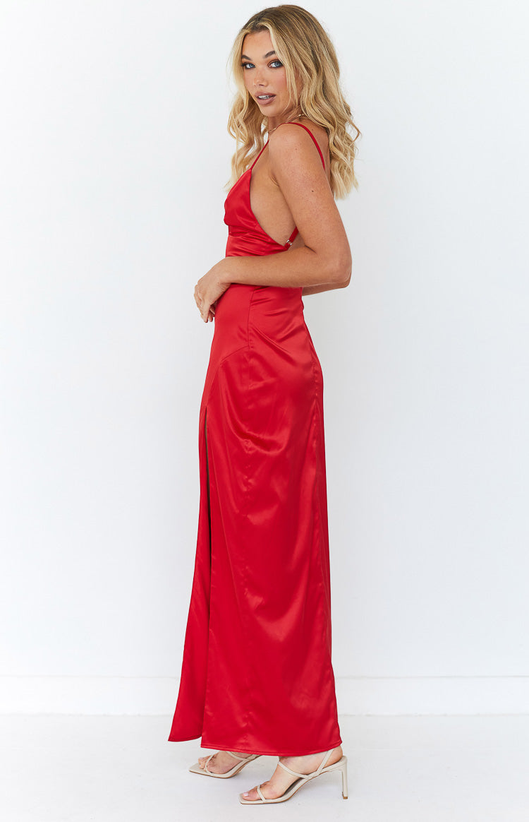 Side view of a red satin maxi dress with thin spaghetti straps and a high side slit