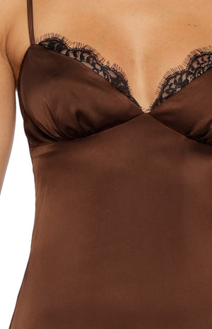 Model wearing a chocolate brown satin midi dress with black lace trim on the cups elegant for a Cocktail party