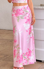 Side view of the pink floral print maxi skirt showing the flowy fabric and a subtle side slit