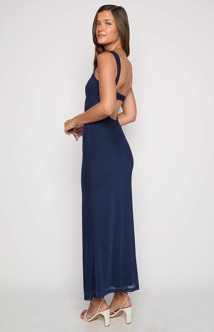 Side view of a navy mesh maxi dress with an open back design and beaded shoulder straps