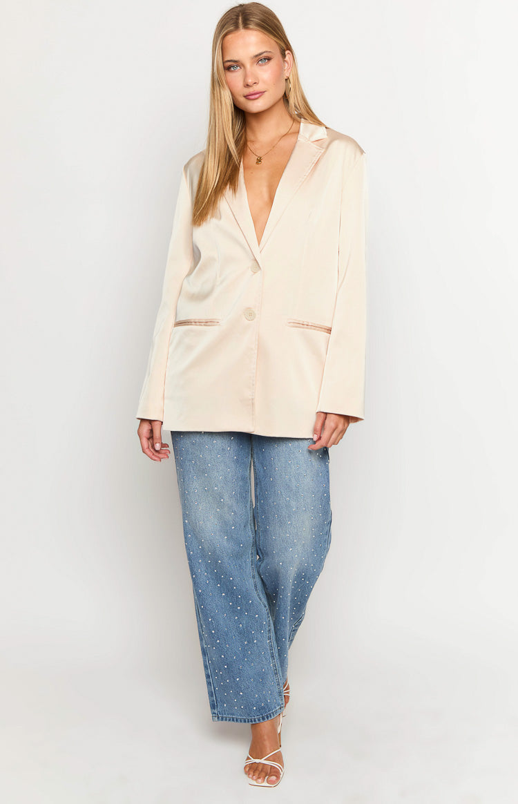 Relaxed cream satin blazer with a single button closure and contrasting trim on the flap pockets