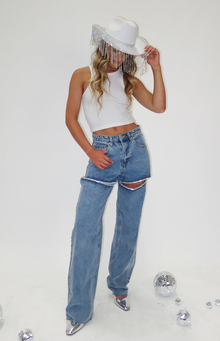 Light wash wide leg denim jeans with diamante trim cutouts on the thighs