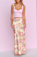 Yellow floral print maxi skirt with a flowy fit and vibrant pink and orange blooms