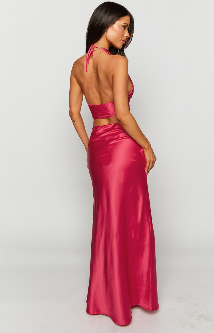 Full length view of a pink satin maxi skirt with a straight, flowing silhouette