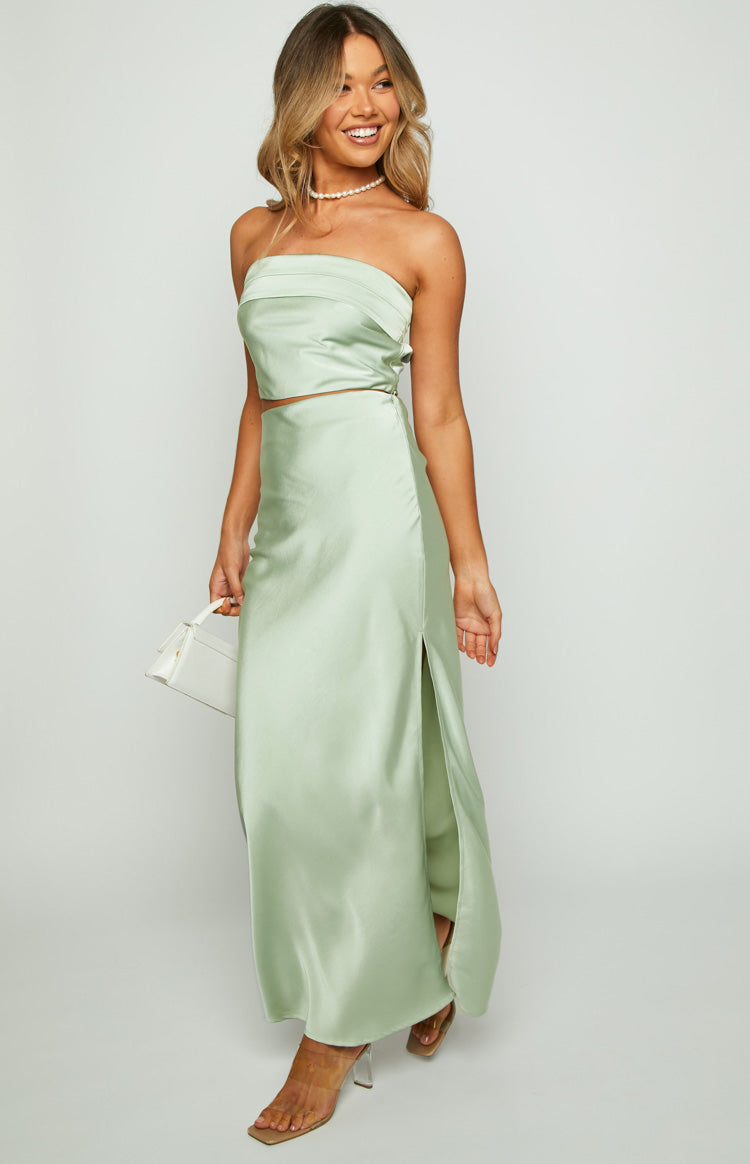 Front view of a sage satin maxi skirt with a high side slit