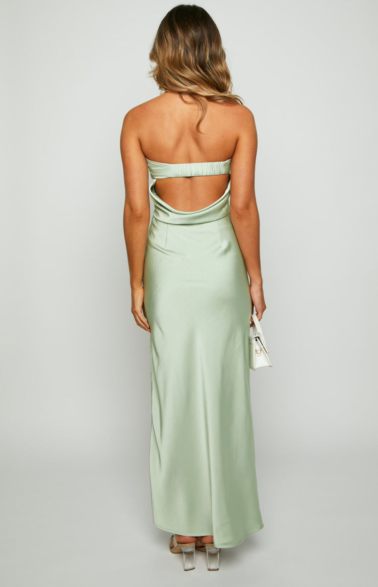 Rear view of a sage green satin maxi skirt, fitted at the waist and flowing smoothly to the floor