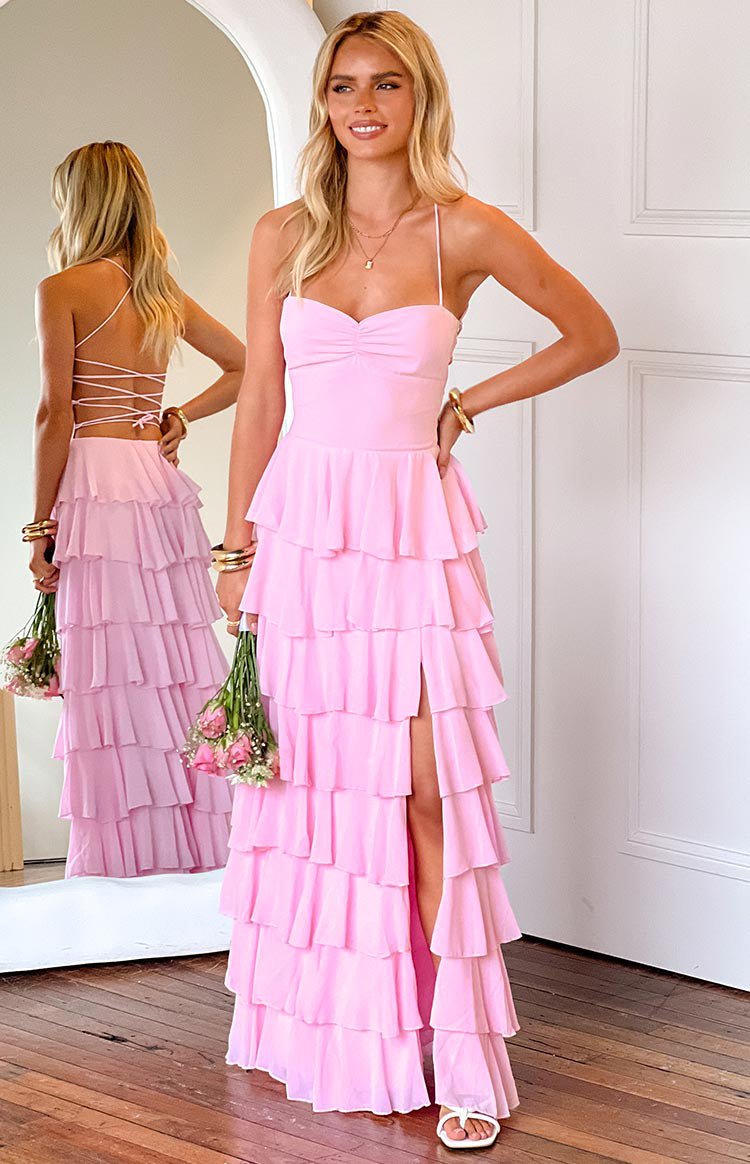 Pink tiered ruffle maxi dress with a sweetheart neckline, ruched bust, high leg slit, and a lace-up back detail