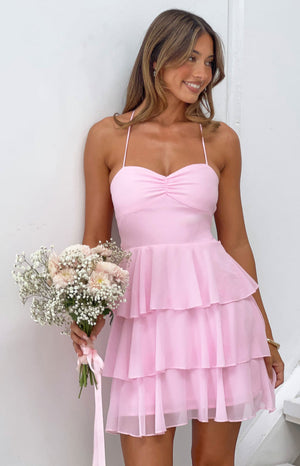 Pink mini dress with a ruched sweetheart bust and three-tiered sheer ruffle skirt