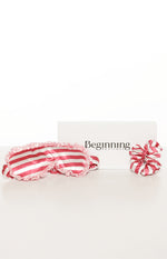 Pink and white striped satin eye mask with ruffled trim and a matching scrunchie