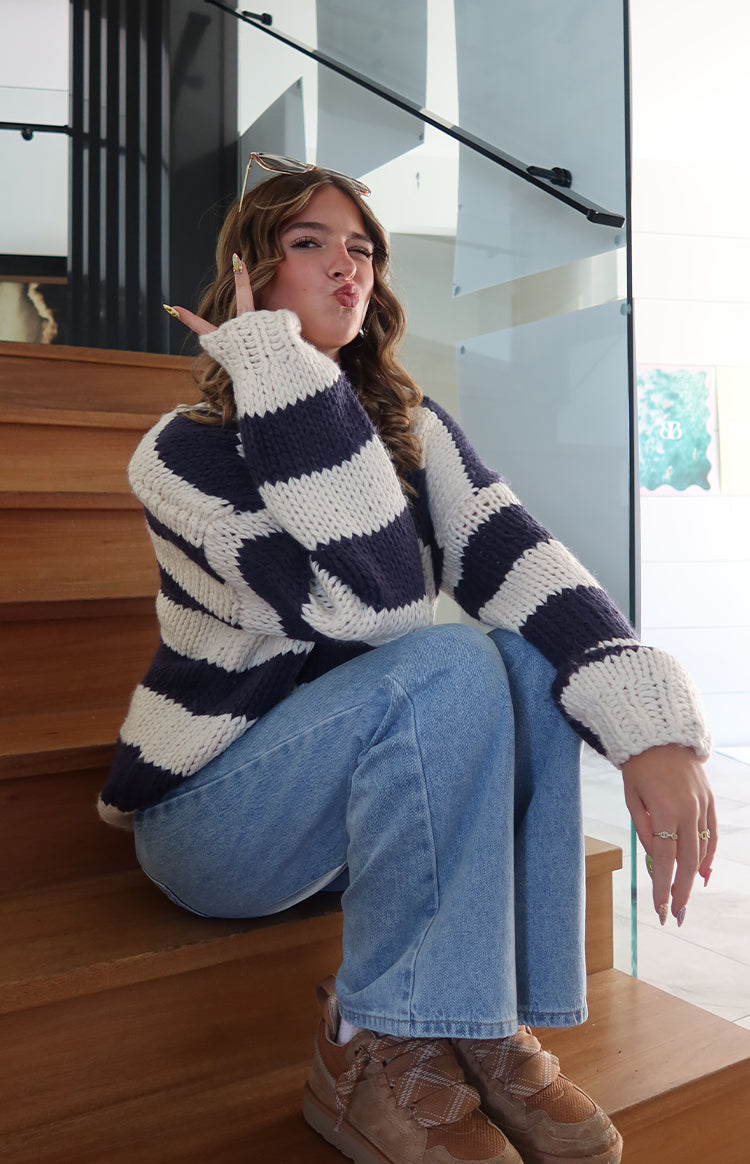Relaxed fit navy and cream striped chunky knit sweater with wide sleeves and ribbed cuffs