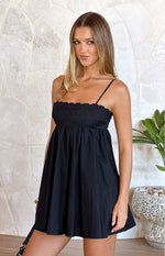 Black mini dress with a scalloped eyelet embroidered bodice and a gathered empire waist flowy skirt
