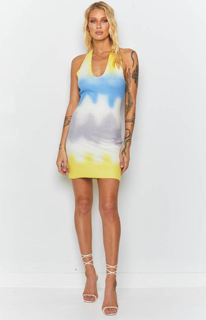 Graffiti print halter mini dress in yellow, blue, and grey knit with a deep V-neck