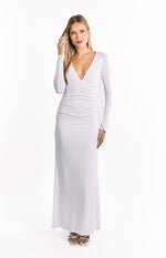 Front view of a white long sleeve maxi dress with a deep V-neckline and ruched side detail