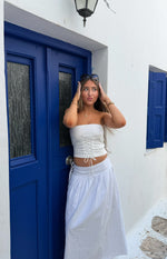 Beginning Boutique Jordy White Side Tie Maxi Skirt white flowy maxi skirt with elasticated waist and adjustable side ties