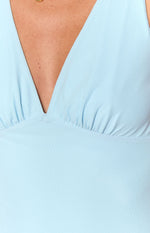 Close-up of the light blue V-neck mini dress with a ruched bustline