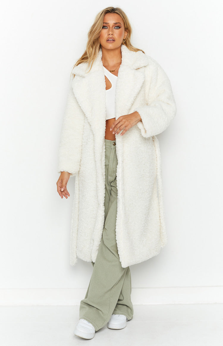 Front view of a white longline teddy coat with wide lapels and a textured, relaxed fit