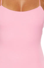 Close-up of the pink crepe maxi dress bodice with a scoop neck and thin spaghetti straps