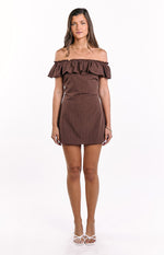 Front view of a brown polka dot mini dress with a ruffled off-shoulder neckline and fitted A-line skirt