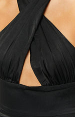 Close-up of the black formal dress bodice showing the gathered criss-cross halter neckline and front cutout